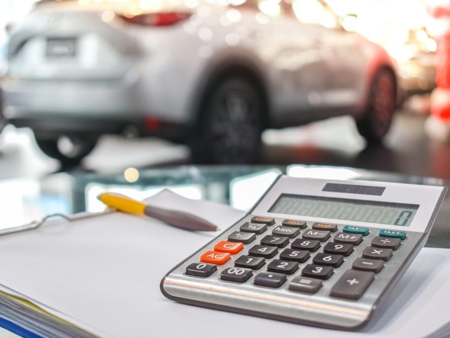 Calculator and financial statements at a dealership