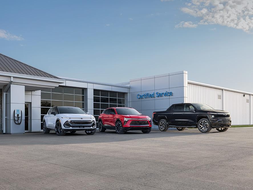 Chevrolet electric vehicles parked outside the service center