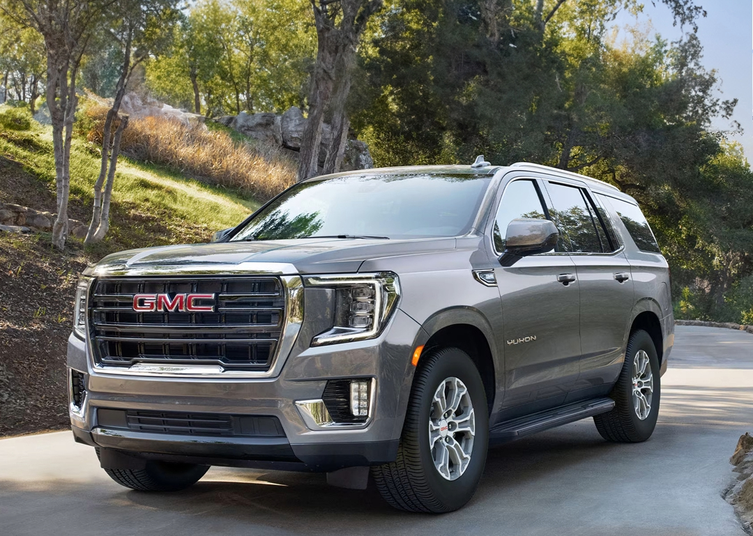 2024 GMC Yukon on a dirt path in the forest