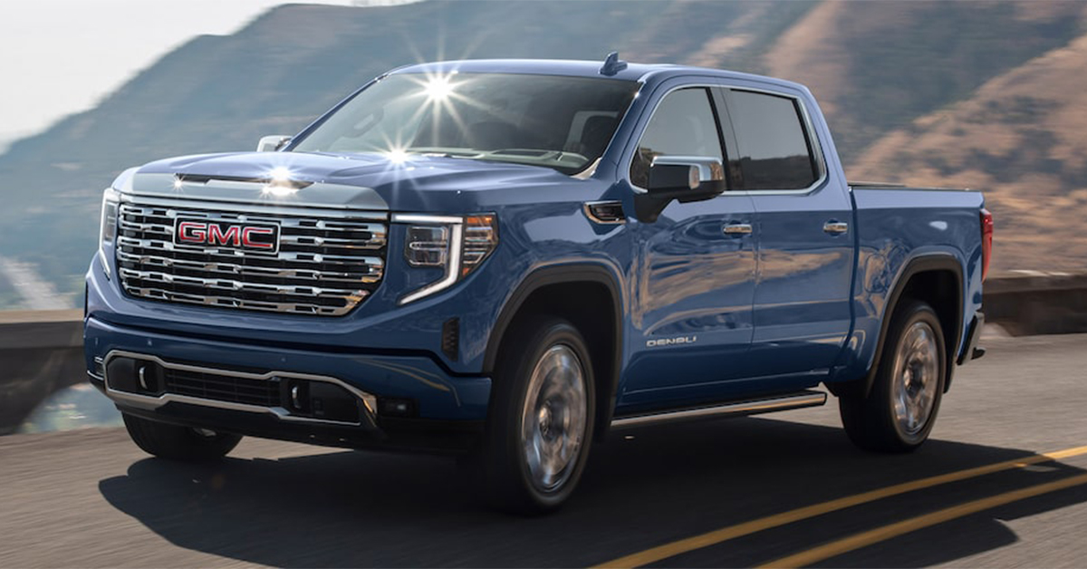 2025 GMC Sierra 1500 Denali Driving down a highway