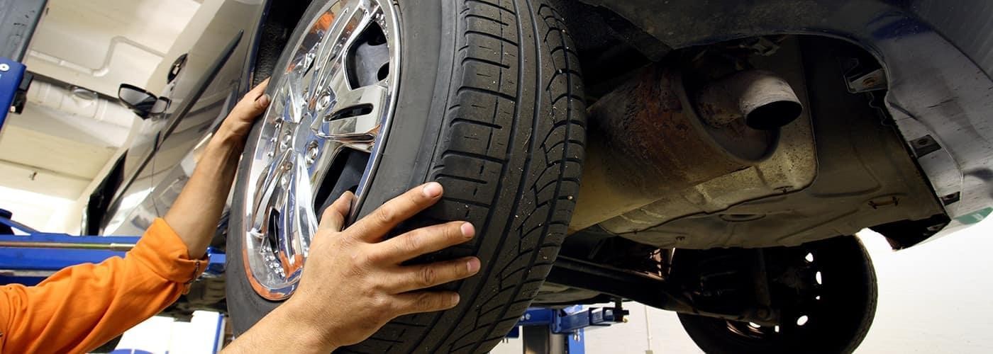 mechanic rotating tires