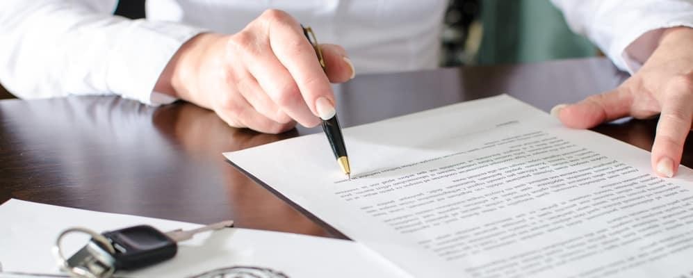 signing a contract for a new car