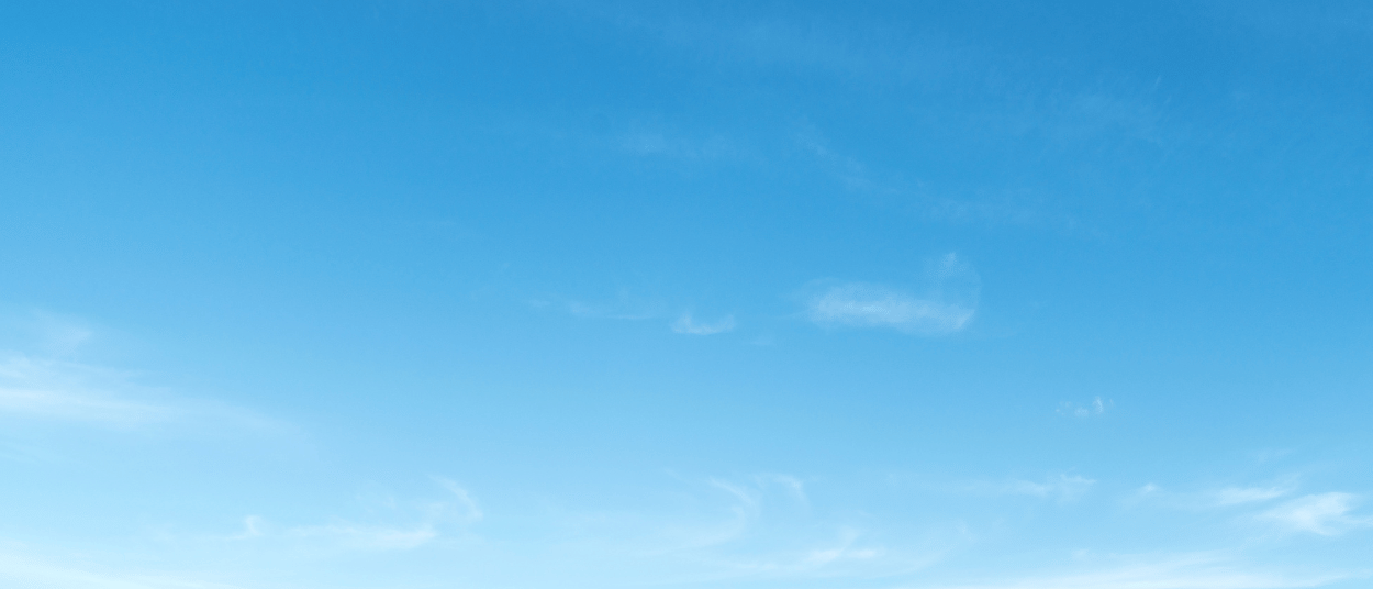 Sunshine over farm with wooden fence
