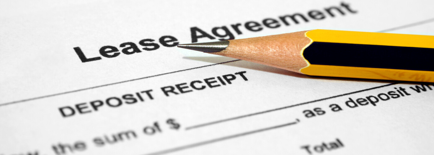 A pencil laying on a GMC lease agreement
