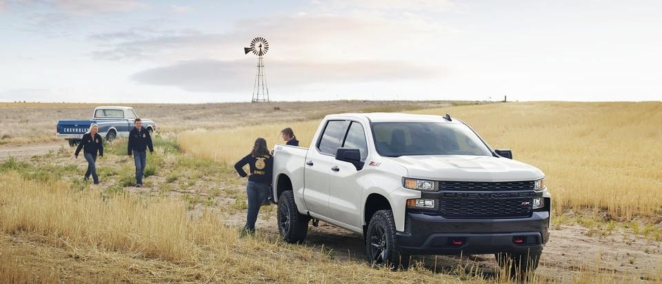 2019 Chevy Silverado 1500 in field with work crew