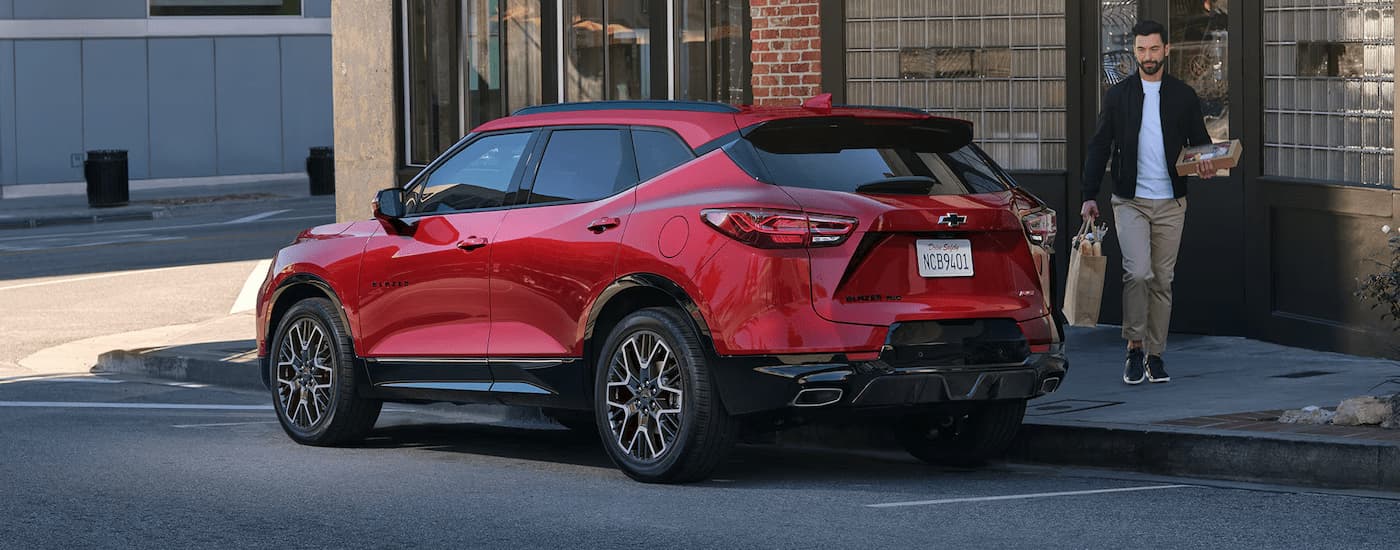 A red 2025 Chevy Blazer RS is parked on the side of a street after leaving a Chevy dealer near Jonesville.