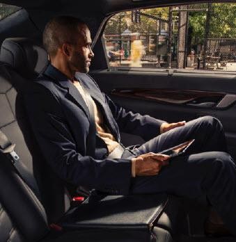 Man comfortably sitting in rear seat