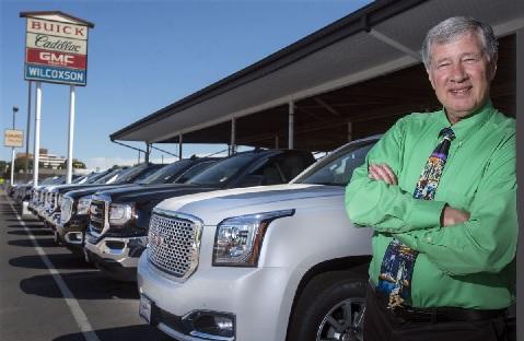 Bill Wilcoxson in front of the Wilcoxson dealership