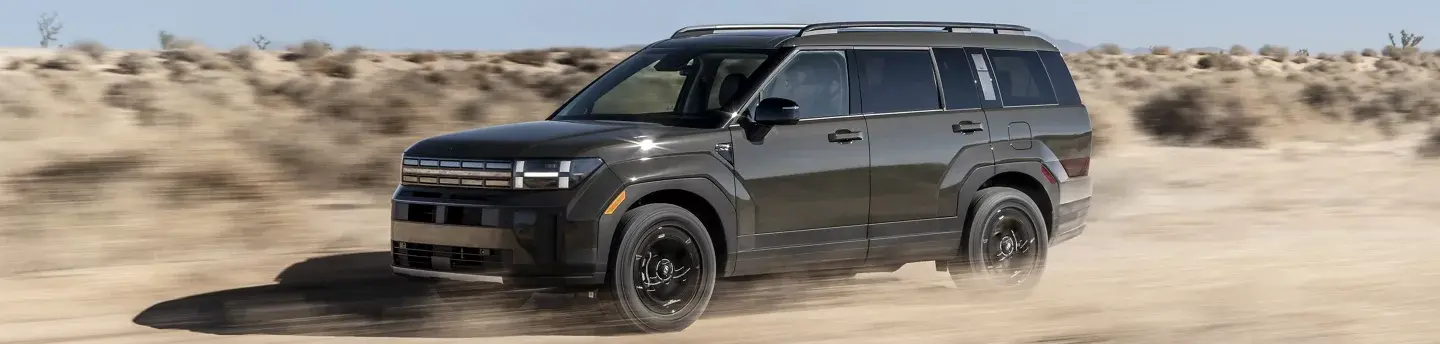 2024 Hyundai Santa Fe SUV Driving Through A Desert