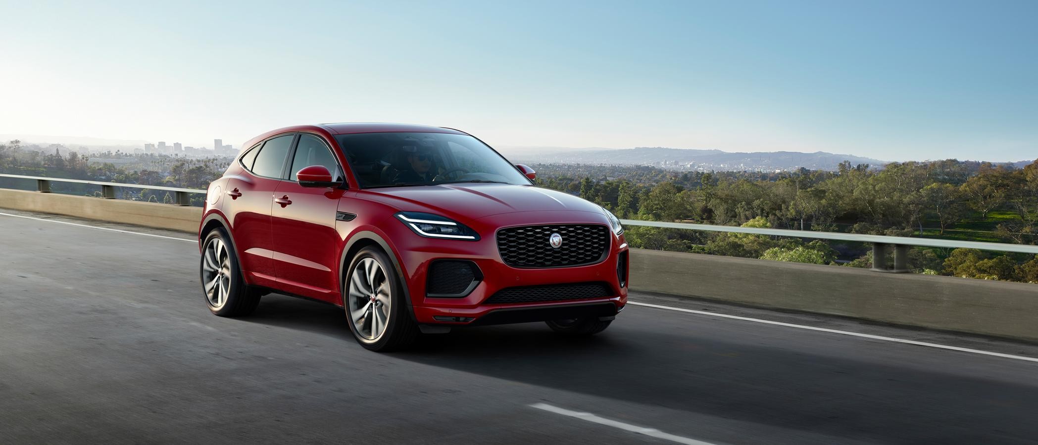 Red Jaguar E-PACE 21 cruising on road