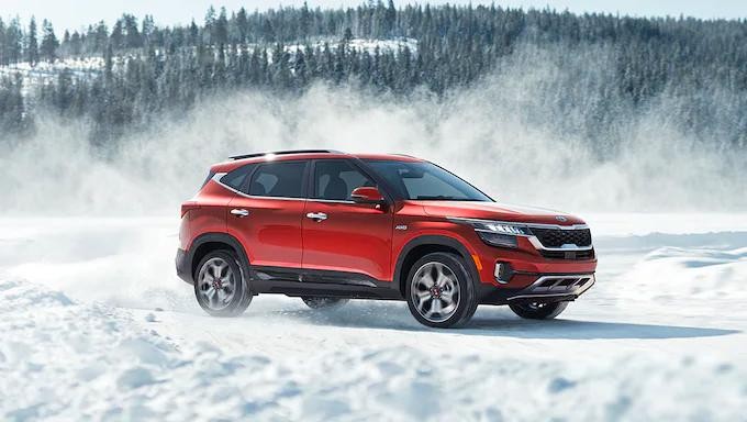 Kia SUV parked in snow