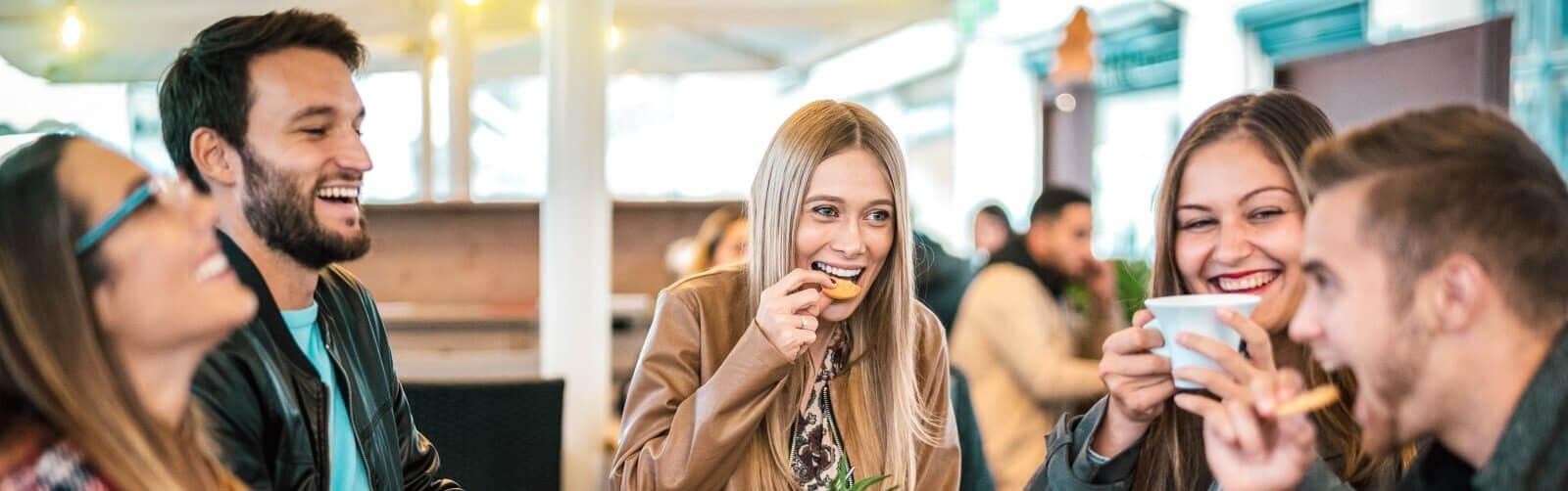 Group of people enjoying in cafe