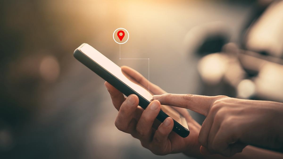 Woman hand using smart phone with navigator location