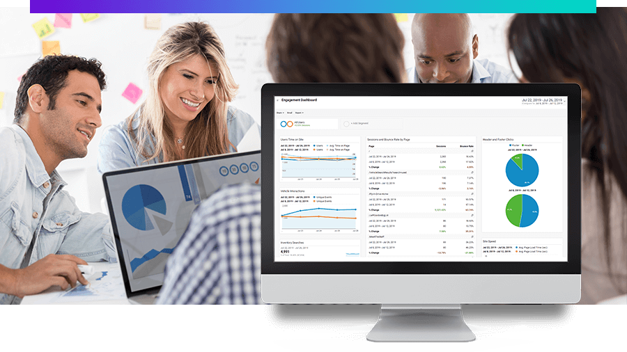 happy people at a conference table looking at graphs