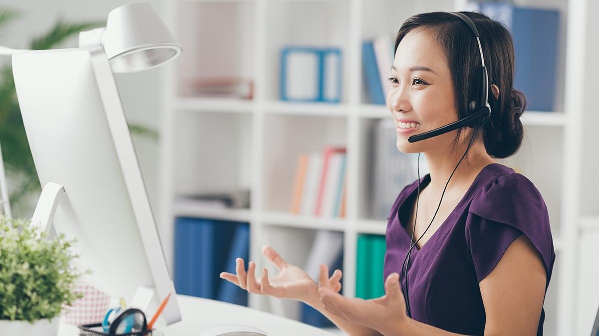 Vietnamese technic support operator in a headset