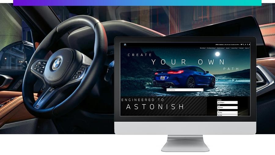 Interior shot of BMW vehicle with screenshot of website