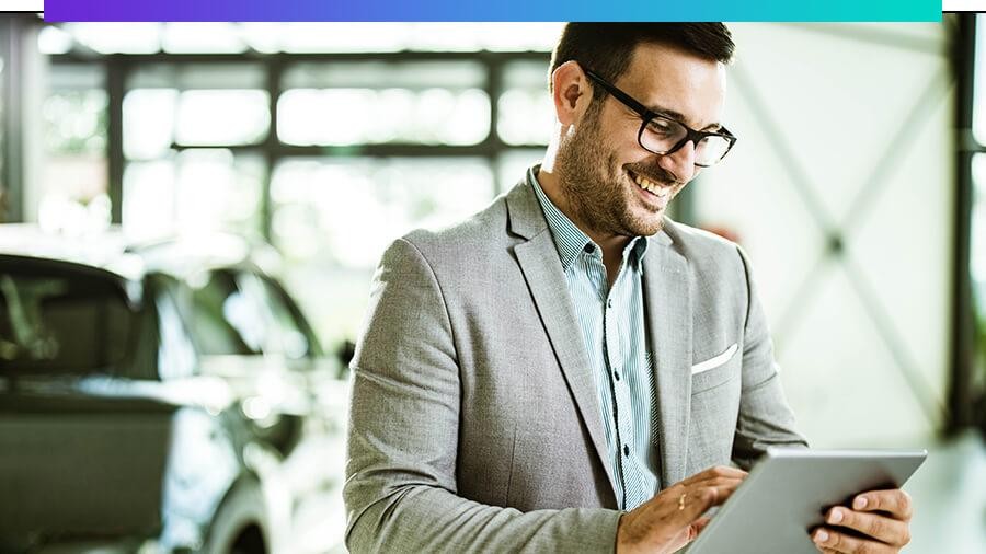 Smiling sales associate using a tablet