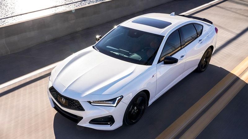 Acura TLX driving over a bridge