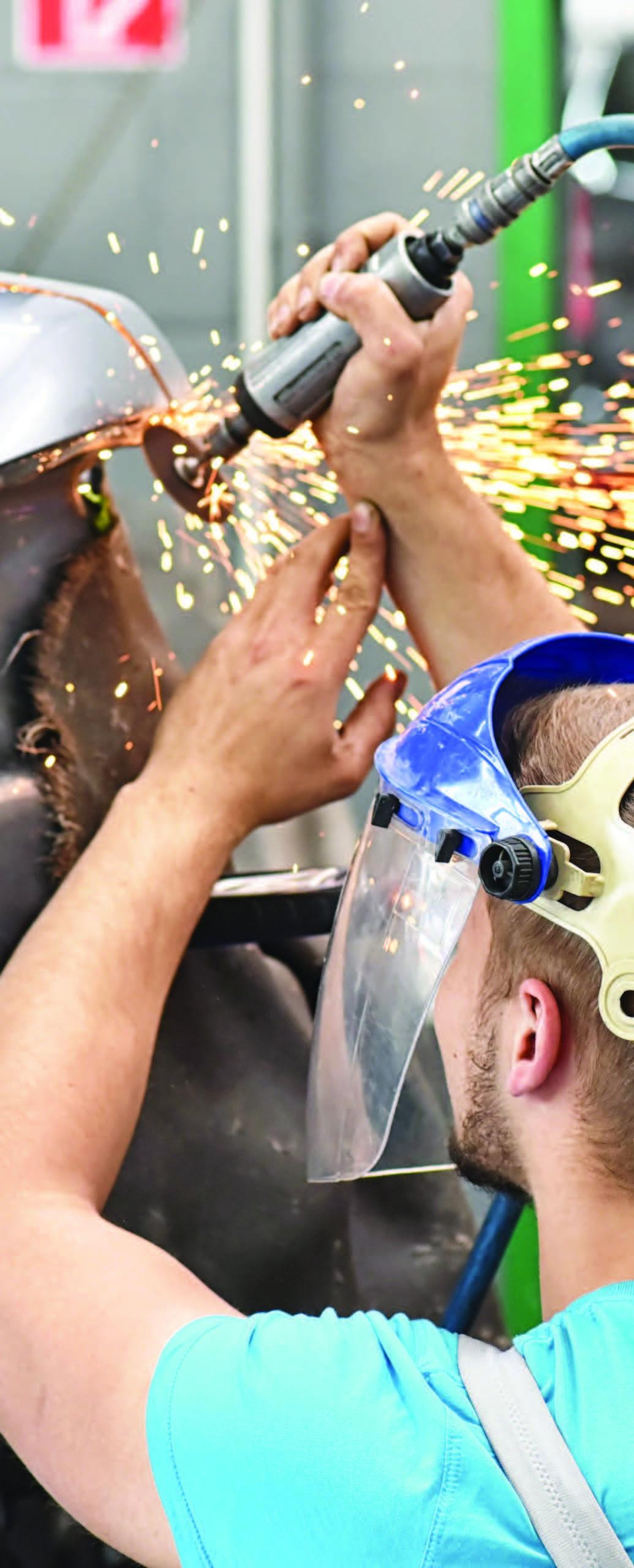 Technician using a grinder