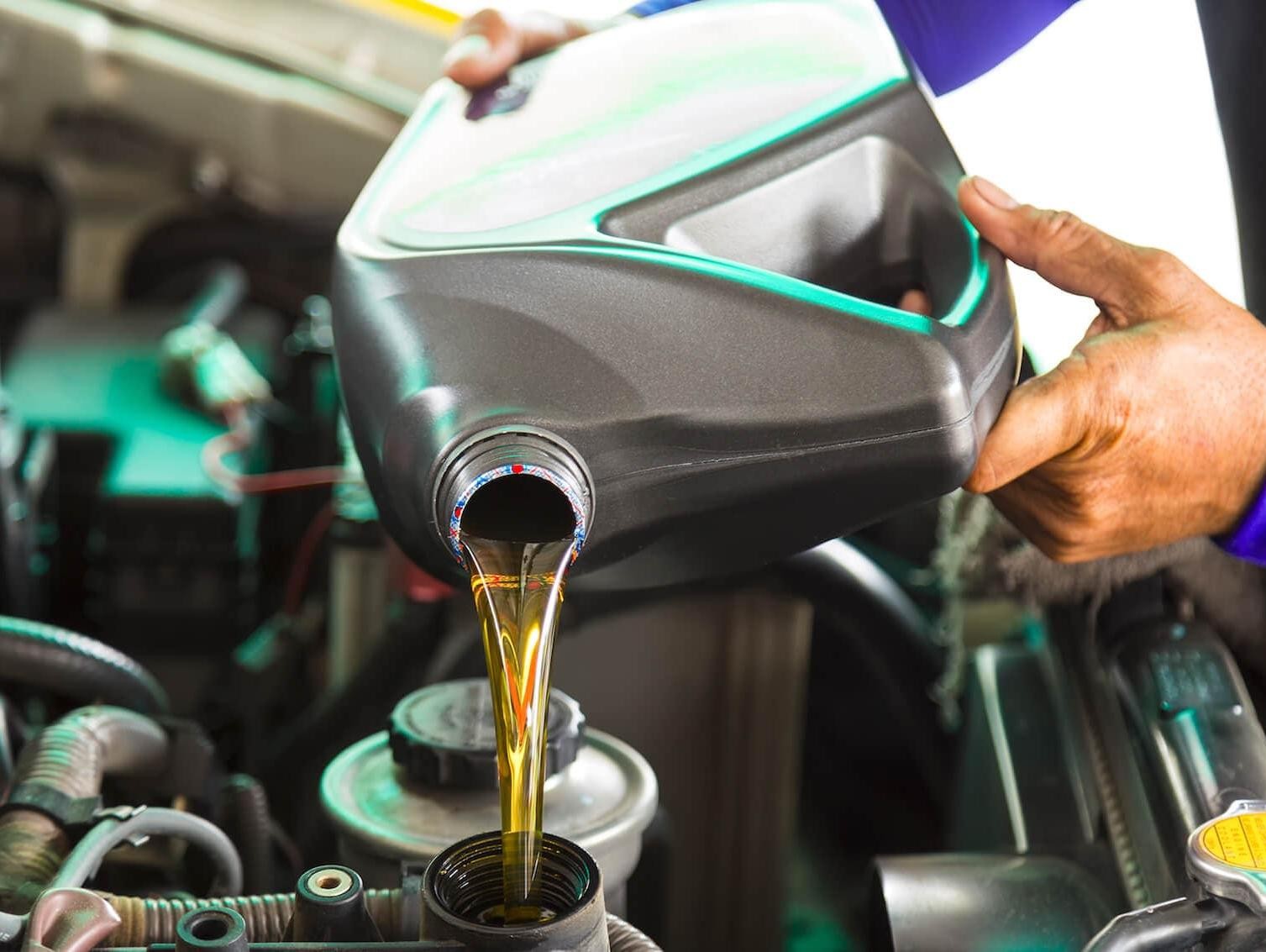 Technician changing oil