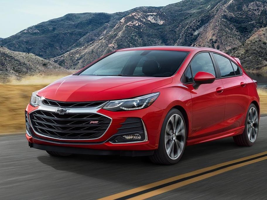 A Red 2019 Chevy Cruze driving on a highway.
