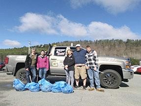 Members of Littleton Chevrolet participate in Earth Day by leading up Meadow Rd in Littleton, NH. 