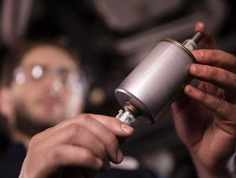Chevrolet Service Technician Replacing Fuel Filter 