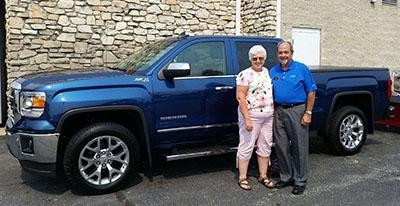 Tom and Peggy LeVora and their new GMC Sierra