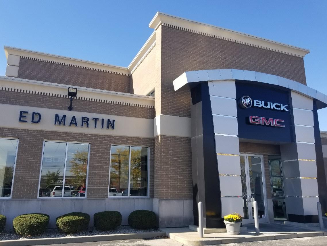 Smiling Women at dealership on phone