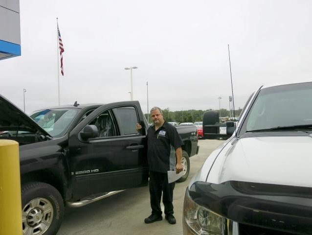 Service technician changing vehicle battery