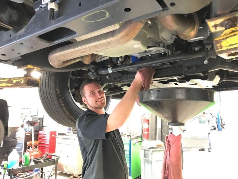 Service technician performing routine maintenance