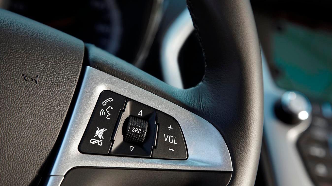 Image of hands free technology buttons on steering wheel.