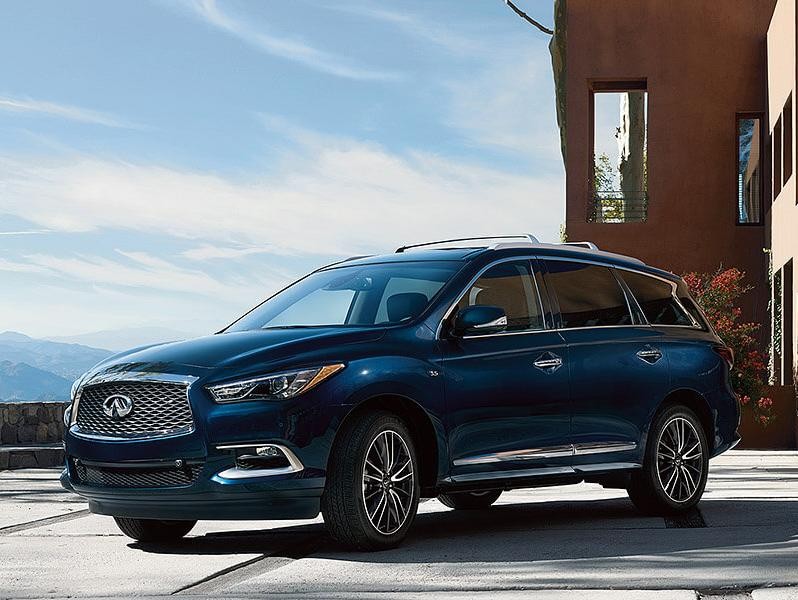 Infiniti Certified Pre-Owned QX60 parked at a scenic house driveway.