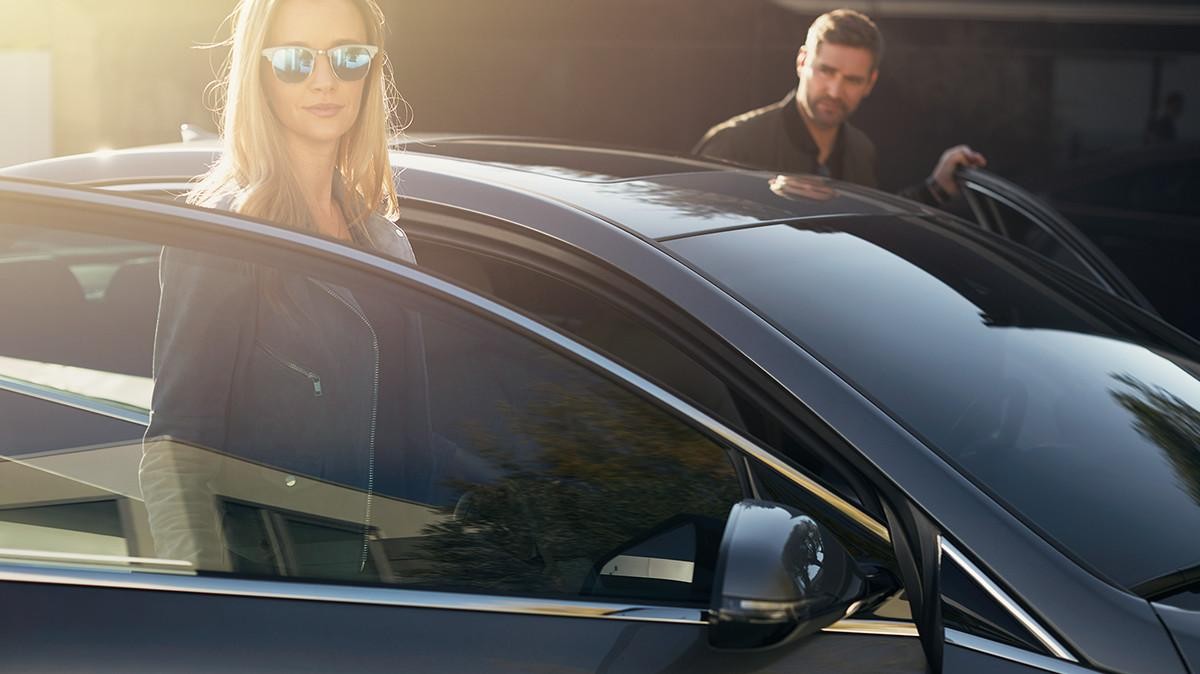 Sonata Limited lifestyle exterior view with driver and passenger.
