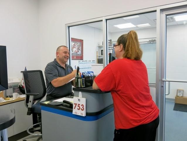 Chevrolet Service technician helping customer