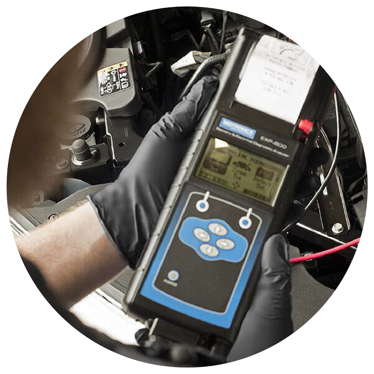 Service technician doing diagnosis on a vehicle.