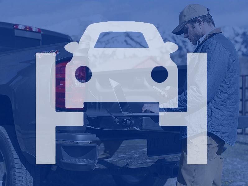 Service technician inspecting vehicle
