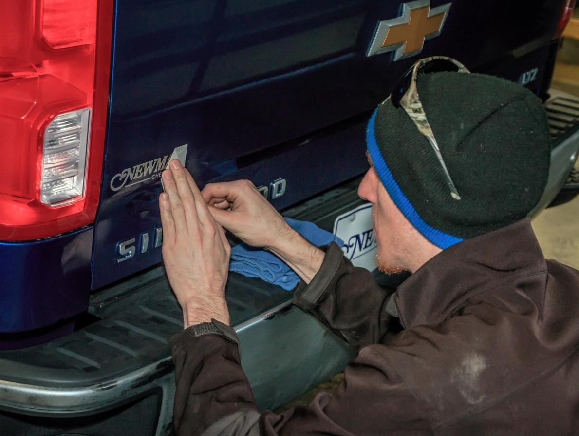 Dustin placing sticker