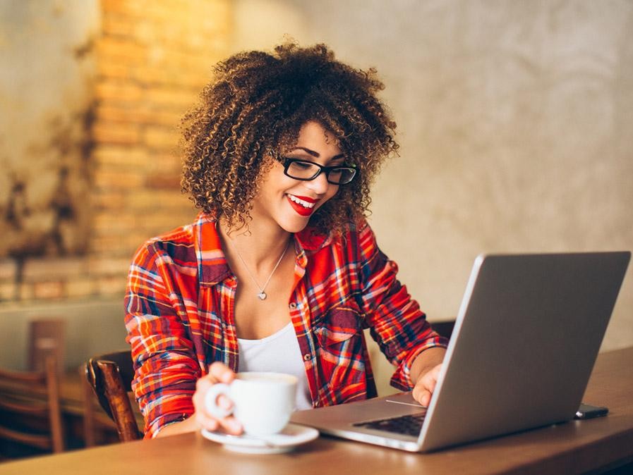 iStock-541288714_Woman-at-Cafe-w-Laptop_16X9.jpg
