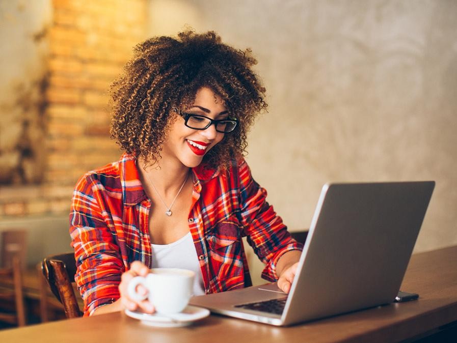 iStock-541288714_Woman-at-Cafe-w-Laptop_16X9.jpg