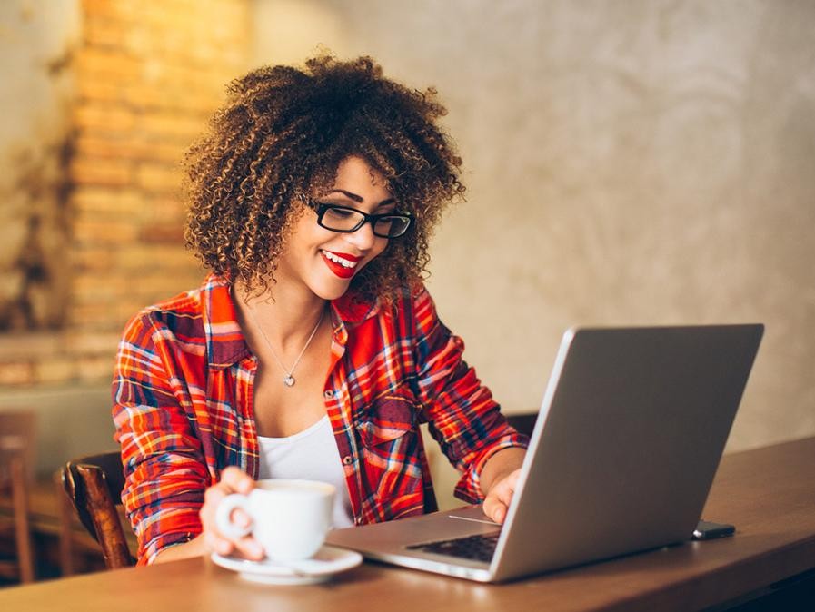 iStock-541288714_Woman-at-Cafe-w-Laptop_16X9.jpg