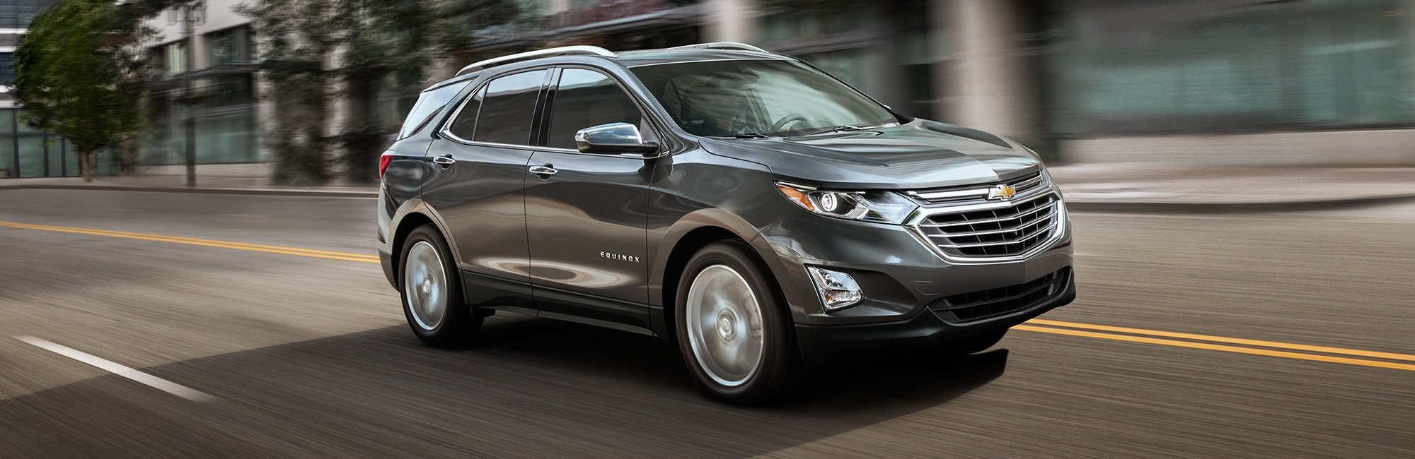 2018 Equinox driving down the road. 
