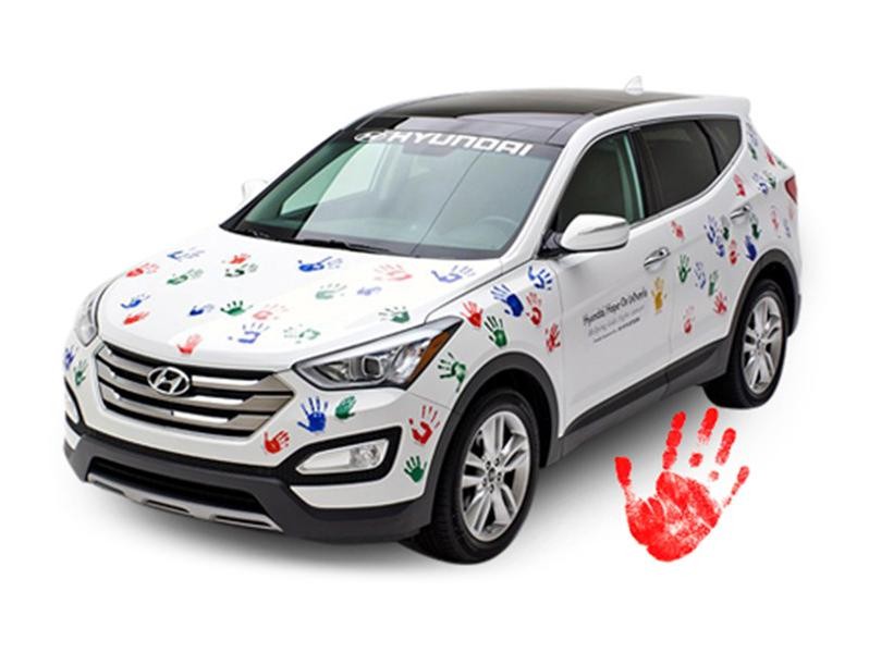 Hope On Wheel vehicle with hand print.