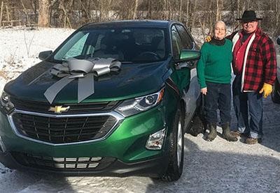 Santa left a present in the driveway for Sally with the help of his elf, Pete.
