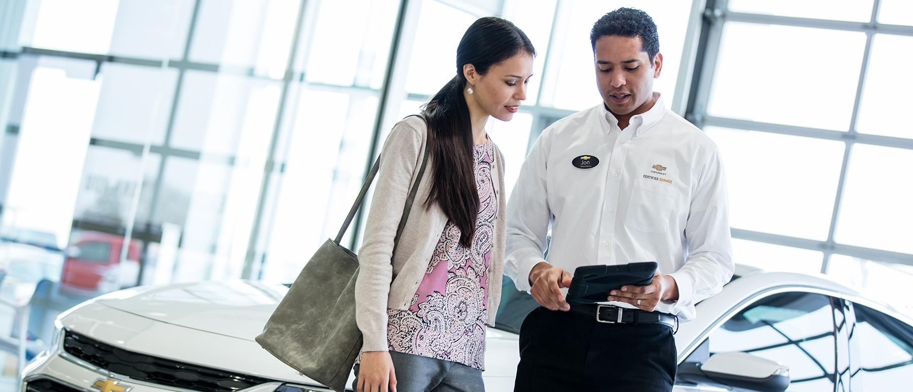 Chevrolet service representative speaking with customer