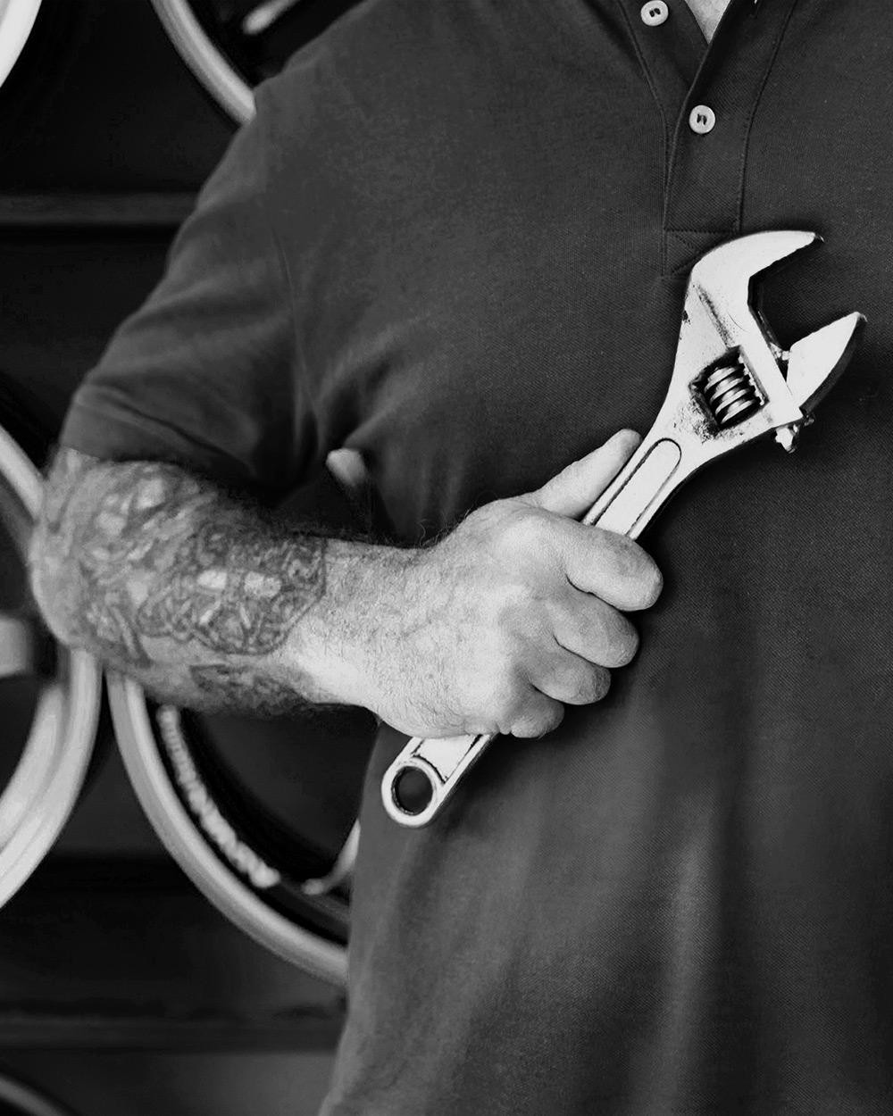 dude holding a wrench